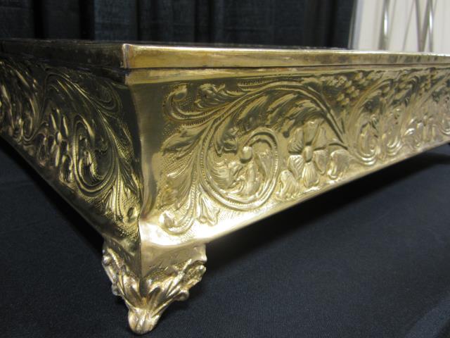 Where to find 22 SQUARE BRASS CAKE STAND in Longview